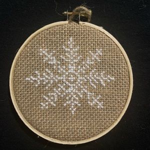 Snowflake cross stitch on burlap